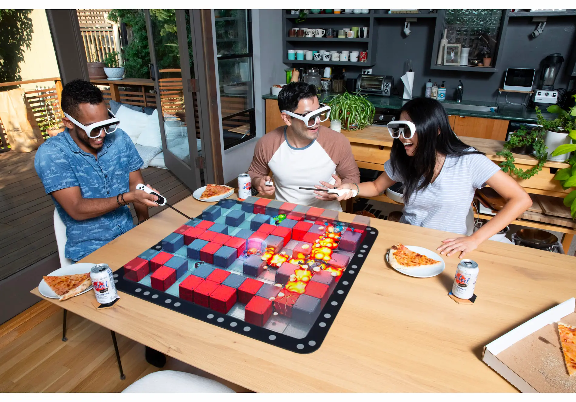 People enjoy a snack around a tilt five gameboard